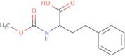 2-[(Methoxycarbonyl)amino]-4-phenylbutanoic acid