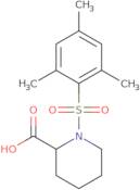 1-(Mesitylsulfonyl)piperidine-2-carboxylic acid