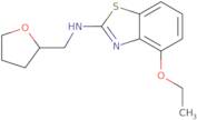 4-Ethoxy-N-(tetrahydrofuran-2-ylmethyl)-1,3-benzothiazol-2-amine