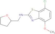 7-Chloro-4-methoxy-N-(tetrahydrofuran-2-ylmethyl)-1,3-benzothiazol-2-amine