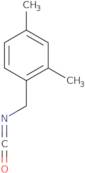1-(Isocyanatomethyl)-2,4-dimethylbenzene