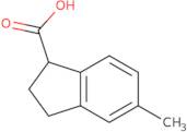 5-Methyl-2,3-dihydro-1H-indene-1-carboxylic acid
