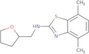 4,7-Dimethyl-N-(tetrahydrofuran-2-ylmethyl)-1,3-benzothiazol-2-amine