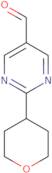 2-(Oxan-4-yl)pyrimidine-5-carbaldehyde