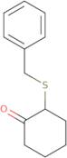 2-(Benzylsulfanyl)cyclohexan-1-one