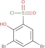 3,5-Dibromo-2-hydroxybenzene-1-sulfonyl chloride