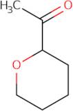 1-(Oxan-2-yl)ethan-1-one
