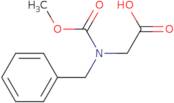 2-[benzyl(methoxycarbonyl)amino]acetic acid