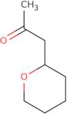 1-(Oxan-2-yl)propan-2-one