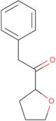 1-(Oxolan-2-yl)-2-phenylethan-1-one