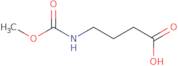 4-[(Methoxycarbonyl)amino]butanoic acid