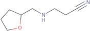 3-{[(Oxolan-2-yl)methyl]amino}propanenitrile