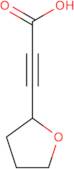 3-(Oxolan-2-yl)prop-2-ynoic acid