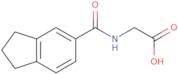 2-(2,3-Dihydro-1H-inden-5-ylformamido)acetic acid