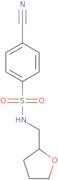 4-Cyano-N-(oxolan-2-ylmethyl)benzene-1-sulfonamide