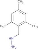 (Mesitylmethyl)hydrazine