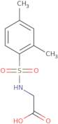 2-(2,4-Dimethylbenzenesulfonamido)acetic acid