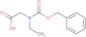 2-{[(Benzyloxy)carbonyl](ethyl)amino}acetic acid