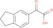 2-(2,3-Dihydro-1H-inden-5-yl)-2-oxoacetic acid