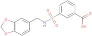 3-{[(1,3-Dioxaindan-5-yl)methyl]sulfamoyl}benzoic acid