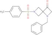 1-Benzyl-6-(4-methylbenzenesulfonyl)-1,6-diazaspiro[3.3]heptan-3-one