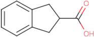 Indane-2-carboxylic acid