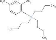 1-(Tributylstannyl)-2,4-dimethylbenzene