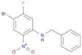 Benzenemethanamine, N-(4-bromo-5-fluoro-2-nitrophenyl)-
