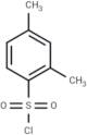 2,4-Dimethylbenzene-1-sulfonyl chloride