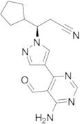 (R)-3-(4-(6-Amino-5-formylpyrimidin-4-yl)-1H-pyrazol-1-yl)-3-cyclopentylpropanenitrile