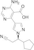 (R)-4-Amino-6-(1-(2-cyano-1-cyclopentylethyl)-1H-pyrazol-4-yl)pyrimidine-5-carboxylic Acid