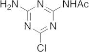 2-Chloro-4-acetamido-6-amino-s-triazine