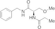 N-Descarboxymethyl-N-carboxyethyl Lacosamide (Impurity)