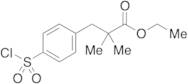 Ethyl 2,2-Dimethyl-3-(4-chlorosulfonylphenyl)propionate