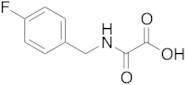 {[(4-fluorophenyl)methyl]carbamoyl}formic Acid