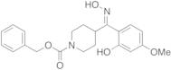 (E)-2-(5-Methoxy)phenol 4-(N-Benzyloxycarbonyl)piperidinyl-methanone Oxime