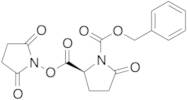 Phenylmethyl (2S)-2-[[(2,5-Dioxo-1-pyrrolidinyl)oxy]carbonyl]-5-oxo-1-pyrrolidinecarboxylic Acid E…